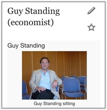 Guy Standing sitting