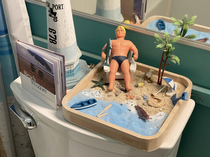 I just had to add my personal flair Stretch Armstrong to this beach theme bathroom