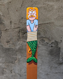 I painted this angry half sailorhalf merman guy tied up on a paint stirrer stick