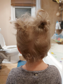 I took out my toddlers elastics and now she has Ace Ventura hair