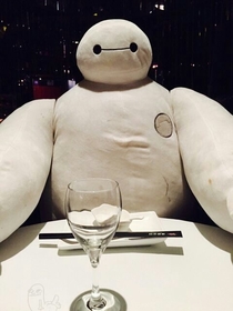 In Shanghai if you go to dinner alone they put this character at the table to keep you company