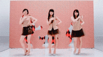 Japanese girls precise dancing through holes in a moving wall