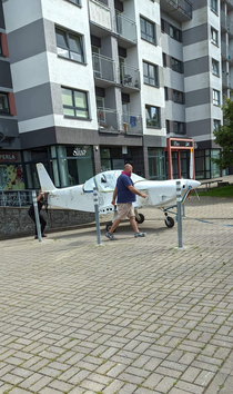 Just a guy pulling his private plane out of an underground parking of an apartment block in Vilnius Lithuania