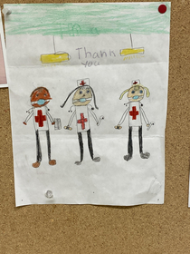 Kids art in the hospital cafeteria looks like the nurses are wearing ball gags and carrying pipes