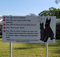 Large sign facing main road homeowner installed after recieving complaints about their dogs