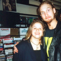 Layne Staley of the grunge band Alice in Chains with a fan in a record store in the s