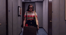 live gif of Sally Yates leaving the building