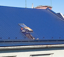 Man sunbathing in the spring sun on the roof because he must stay at home due to the lockdown Czechia Ostrava