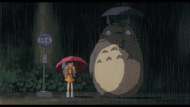Mei Satsuki and Totoro waiting at a bus stop during a rainy night