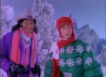 Merry Christmas from Pee Wee Herman and inexplicably Laurence Fishburne in a pink scarf and cowboy hat