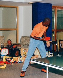 Michael Jordan plays ping pong while Larry Bird gets drunk taken during the  Olympics