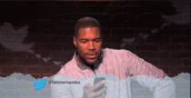 Michael Strahan reads a tweet about himself