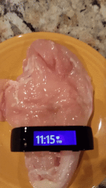 Microsoft Smart watch registering a bpm pulse on a piece of chicken filet