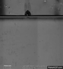 Molten lead droplet hitting water in slow motion 