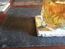 Mother-in-law scolded me for putting my cup on the stone part of her table So she hands me a Stone coaster