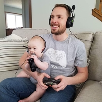 My best bud and his -month-old son playing video games together Sort of