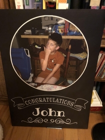 My cousin got me this giant card used a picture of me that hes saved for over  years just to use for this occasion Pen at the bottom middle for scale