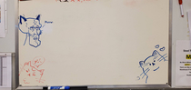 My coworker kept drawing cats on the whiteboard so I added one Can you guess which one is mine