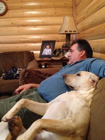 My dad and his dog watch TV together every night
