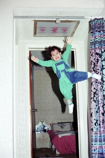 My dad thought -year-old me was strong enough to hang from the curtain rod while he takes a picture