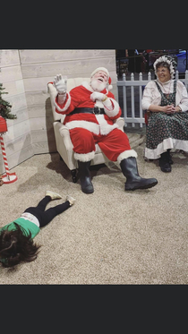 My friends kid was not a fan of Santa this year This was as close as she got