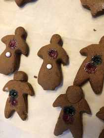 My girlfriend made gingerbread people and put the sprinkles on too soon and they melted Now it looks like they got shot