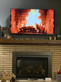 My mom put a fireplace video on the living room tv thats directly above her actual fireplace