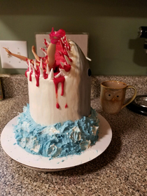 My nephew turned  a few days ago He loves sharks a desperately wanted a cake that looked like a shark eating a person so my sister made this