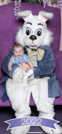 My son giving us the bird while being pictured with the Easter Bunny
