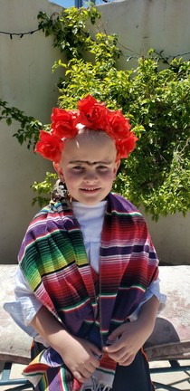 My wife dressed my son up as Frida for a project for his class to recreate her art Today in his Zoom meeting we found out that meant a drawing or painting