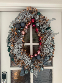 My wifes attempt at a Christmas wreath - I named it our festive door vag
