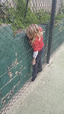 My  year old sister getting stuck in between a wall and a fence