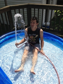 My  yr old husband playing in his new pool We dont have kids btw