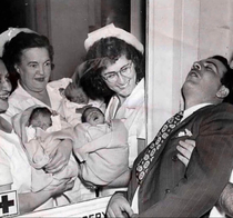 Nurses show triplets to the father who passes out with excitement ultrasound didnt exist back then photo from 