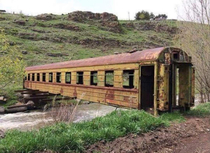 Old abandoned train wagon used as a bridge