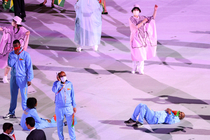 Olympian from Eritrea got tired of standing and laid down on the field in the Olympics opening ceremony