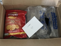 Ordered a lens on eBay Seller forgot to send the lens hood with it and sent it out separately Sent me a note and a packet of crisps What a legend