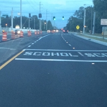 Pic #1 - Road workers in front of my high school misspelled the word school