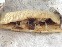 Pic #2 - Taco Bells Triple Steak Stack Ad versus what it actually looks like