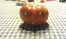 Pic #4 - We had a tomato with a strange growth My mom used a sticky note to make it into a nose