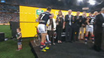 Players receiving their Rings after the Australian Rugby League Grand Final today one of the players kids decides to make his way up onto the stage