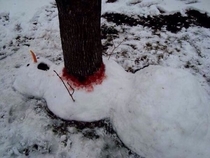 Poor snowman killed by a tree