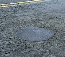 Pot hole out in the country fixed