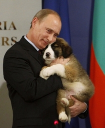 Putin Cuddling a Puppy