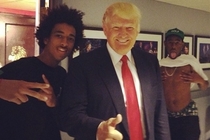 Rapper Tyler the Creator poses for a picture with a fan