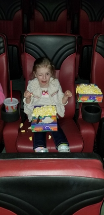 So I took my  year old to her first movie and caught her with the flash on
