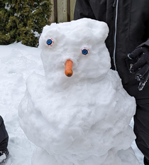 So my kids made a snowman and found Halloween eyes