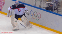 The goalie of Slovakia - Jan Laco - does the greatest tackle in the whole Olympic games
