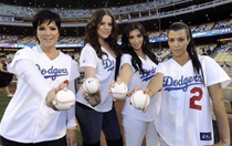 The Kardashians holding white balls for the first time