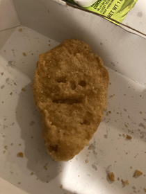 This chicken nugget my daughter got in her meal is not impressed